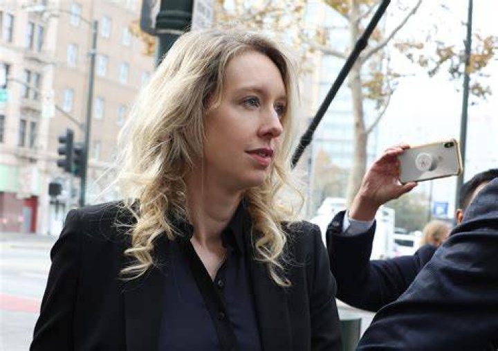 Elizabeth Holmes steps down as Theranos CEO as DOJ levels charges