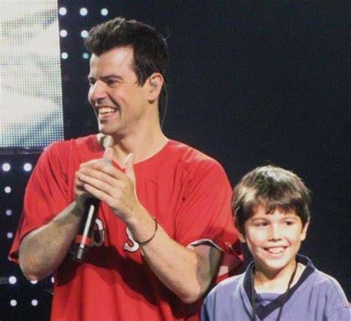Jordan Knight and son with paint guns. Jordan Knight, Jonathan Knight